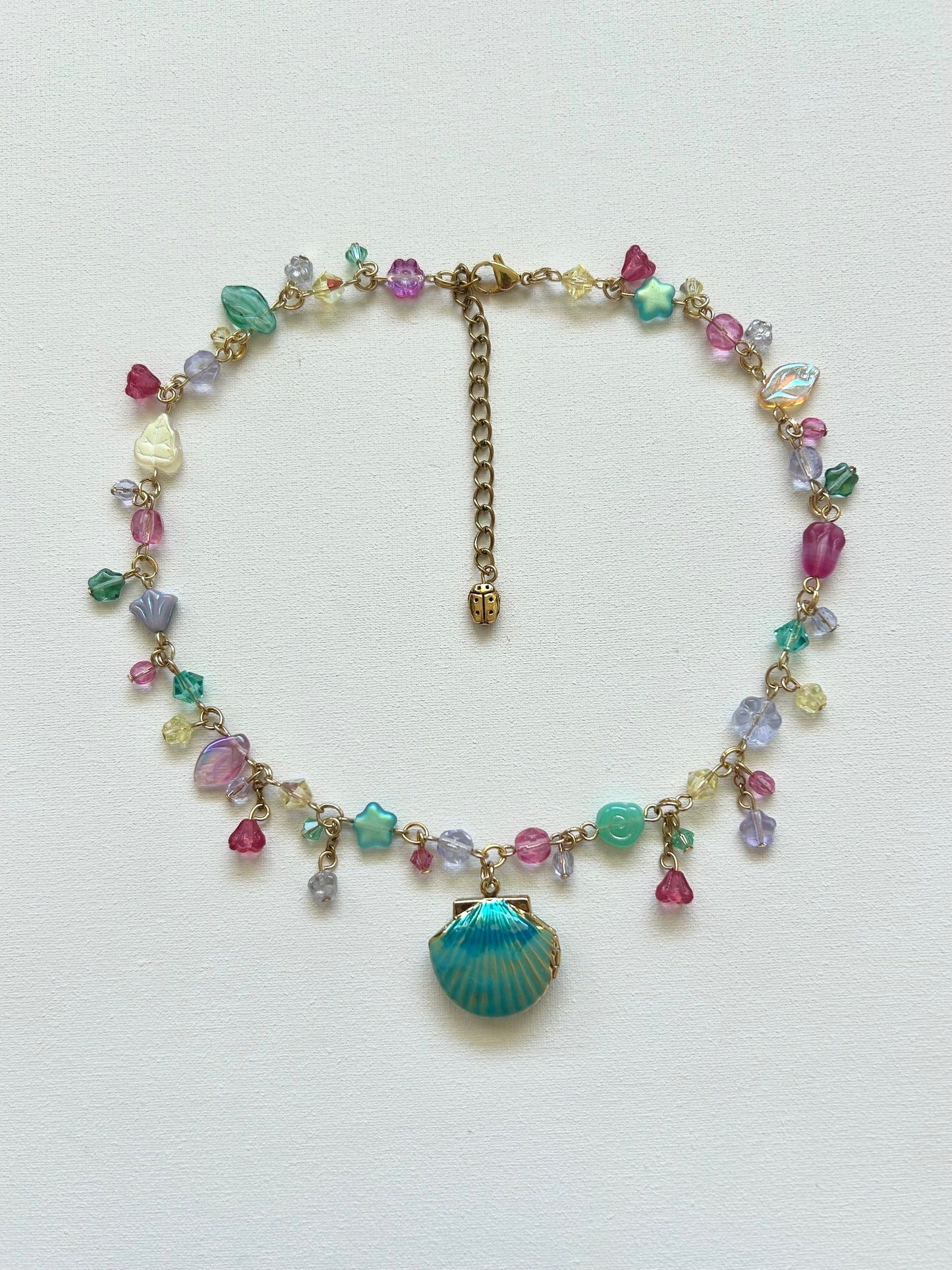 teal seashell locket necklace